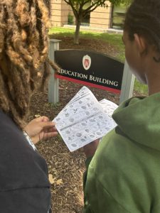 PTL students using a field guide to identify trees on the UW-Madison campus